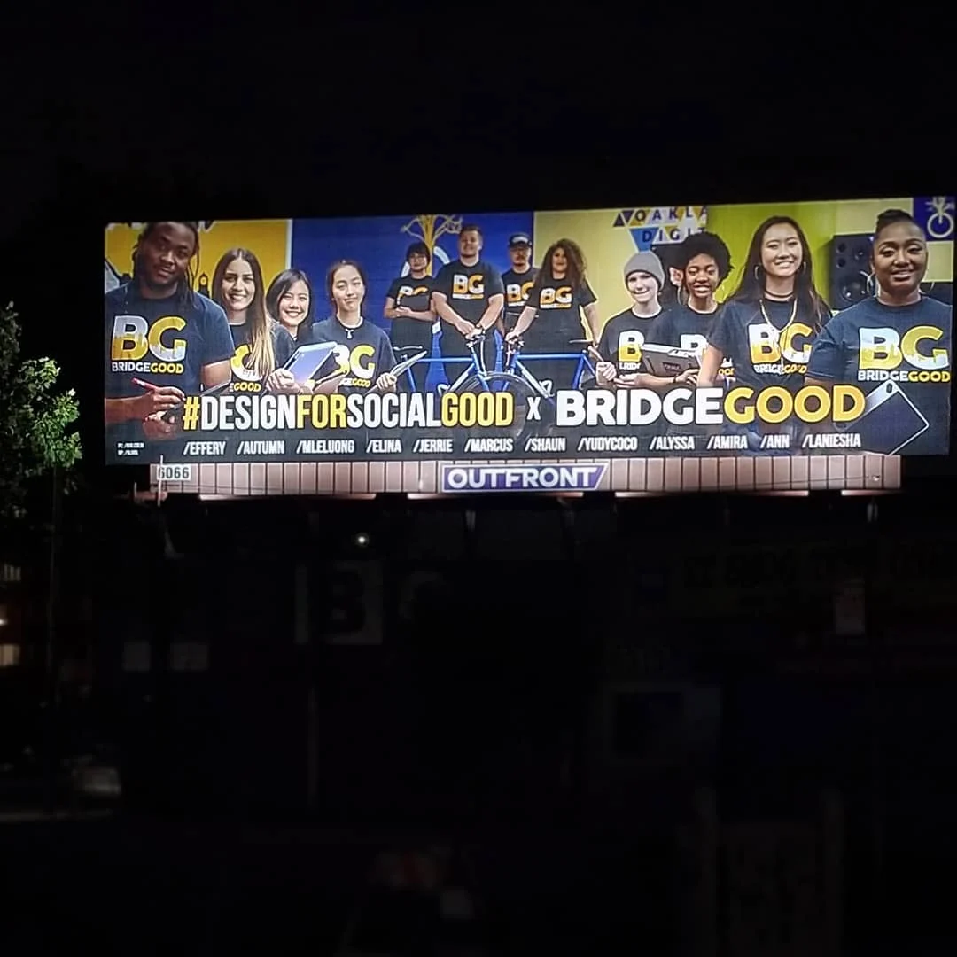 A night billboard shows a smiling group in BG shirts above the words Design for Social Good x BRIDGEGOOD.